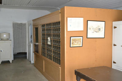 The post office on the right side of the building.
