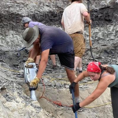 Elías Warshaw uses a jackhammer to remove overburden at the Daspletosaurus wilsoni quarry