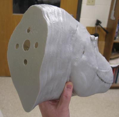 Holes on the back of the bust allow for hanging loops. Large 40cm bust shown in mid-gray.