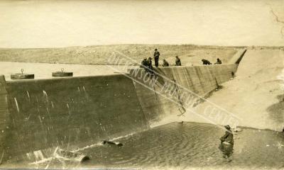 Sepia tone picture of the Heart River Dam. 1911.