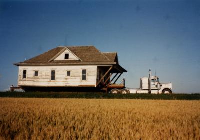 The farmhouse being moved to the park in 1993.