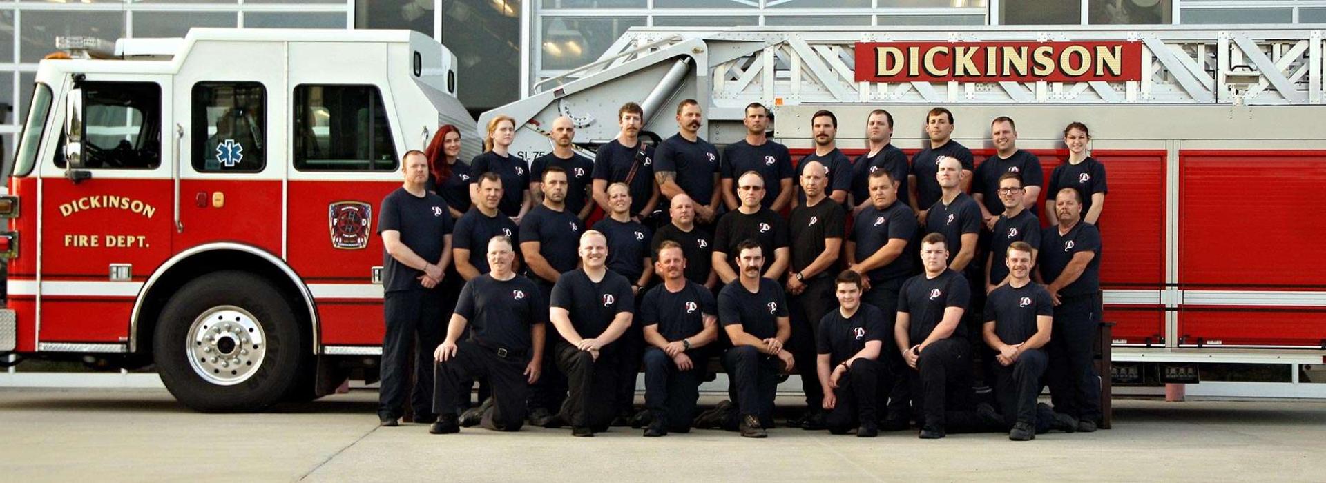 Fire department staff in front of fire truck